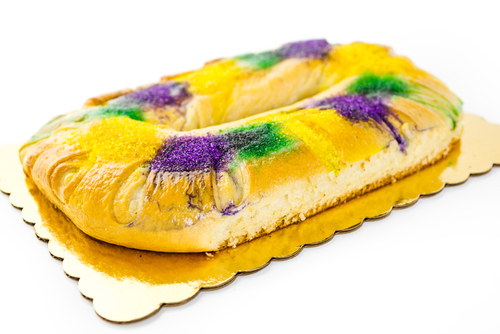 King's cake at a Mardi Gras mystery party game. 